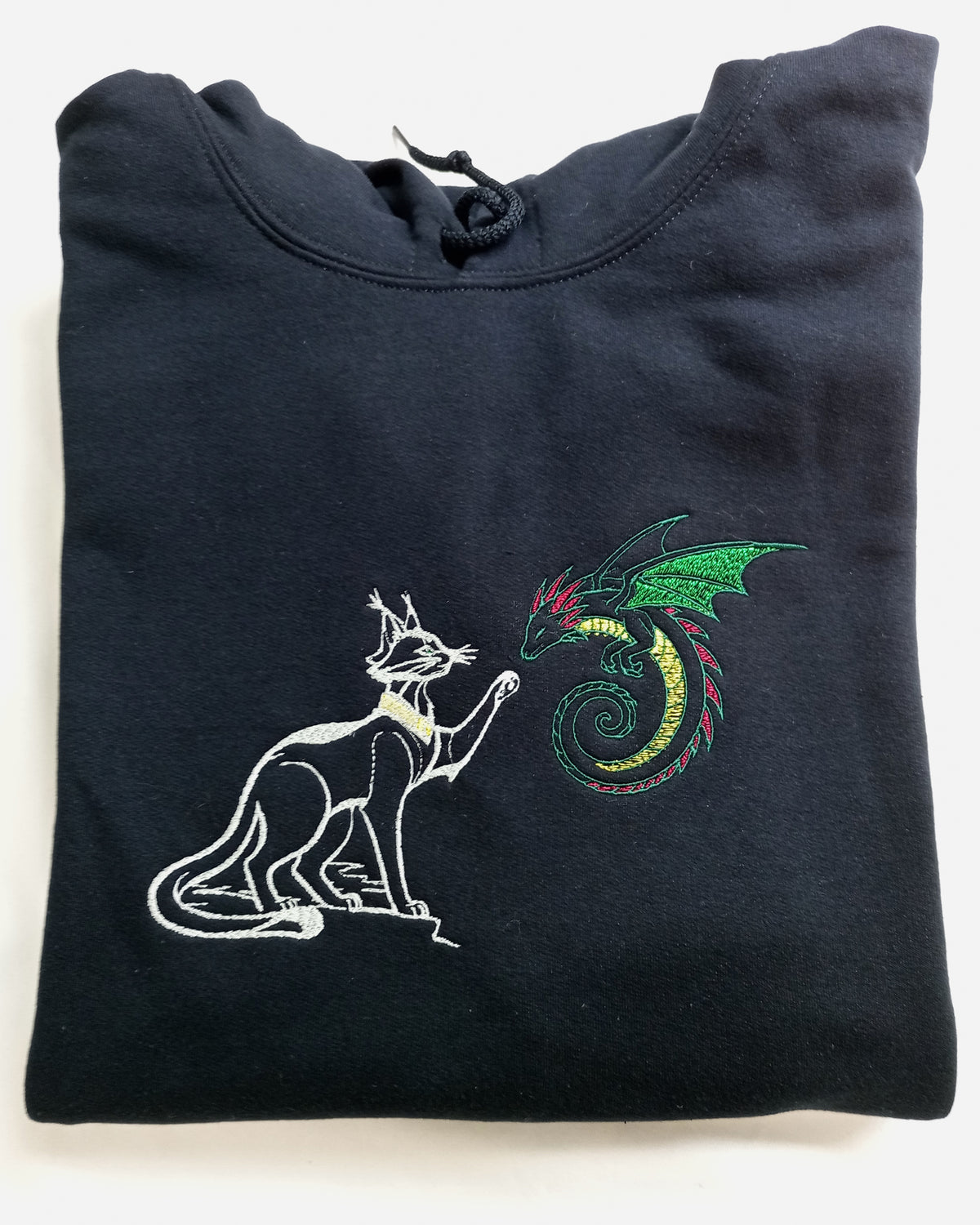 Dragon amical - Blanc et vert sur sweat à capuche noir