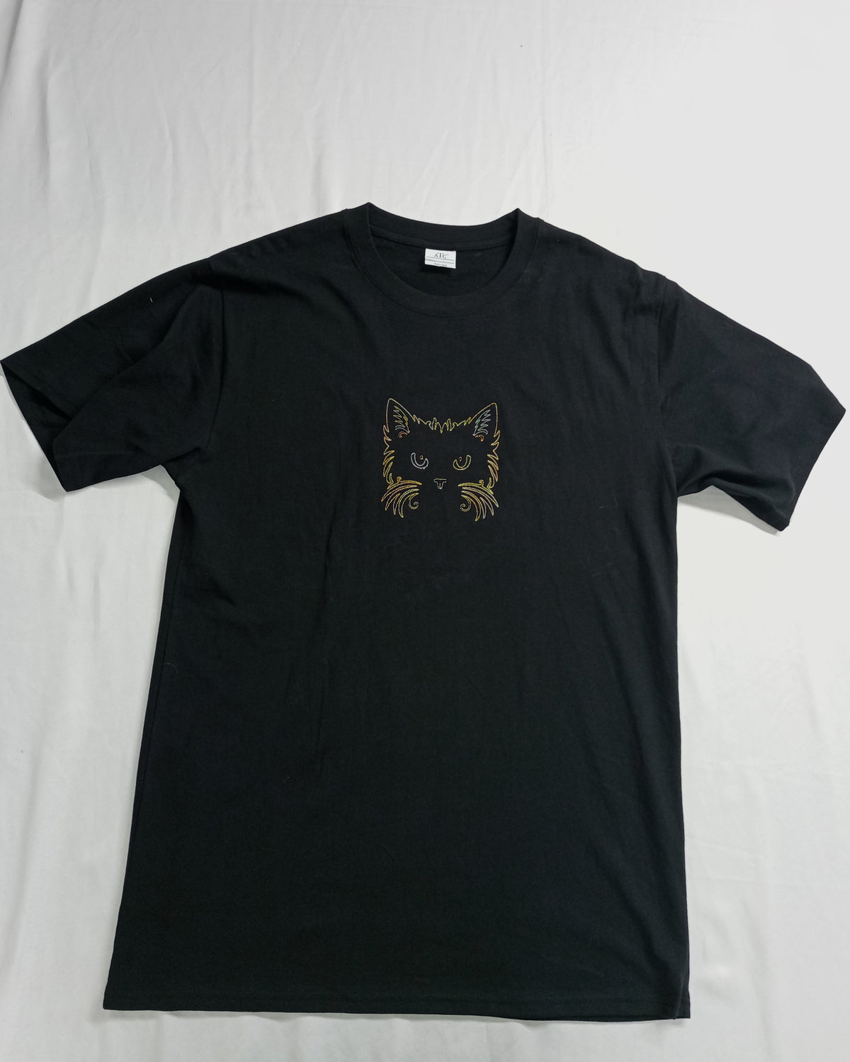 Cat Face - Brown/Orange/Yellow Thread on Black T-Shirt
