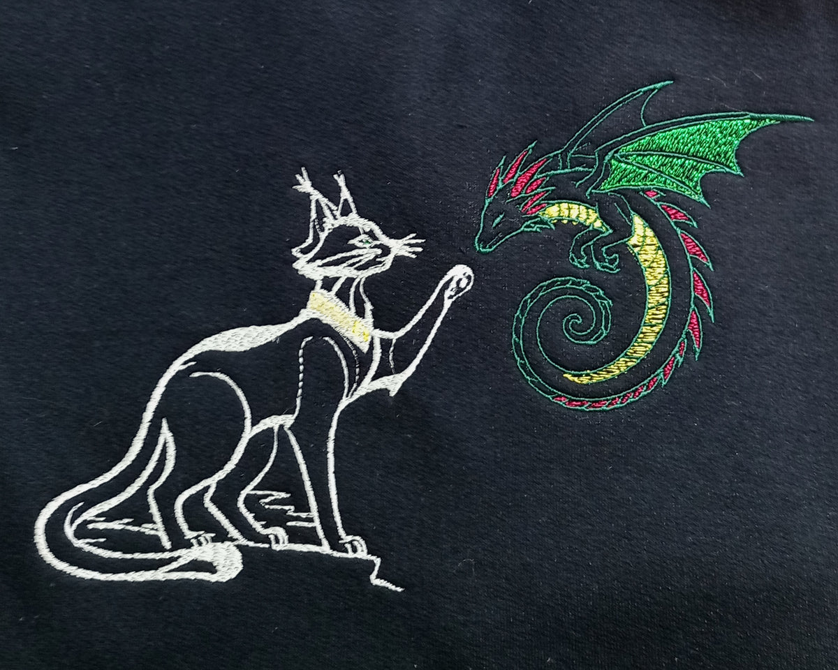 Dragon amical - Blanc et vert sur sweat à capuche noir